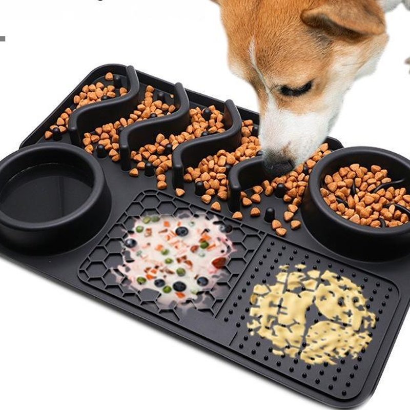 A dog enjoying a Busy Hound enrichment mat